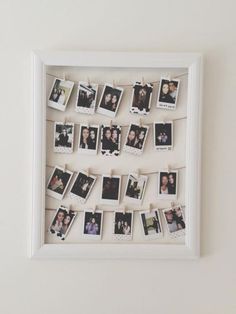 a white frame with photos hanging from it