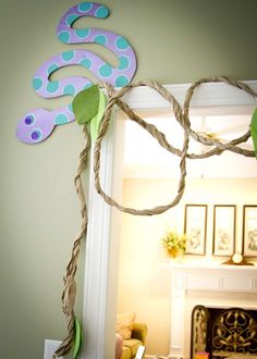 a decorated mirror frame in the shape of a snake