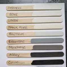 several different colors of paint swatches on a white board with black and gray lettering