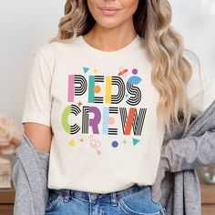 a woman wearing a t - shirt that says pride crew