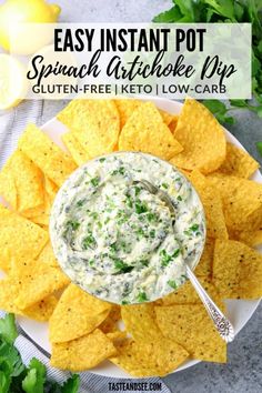 a white plate topped with tortilla chips and dip