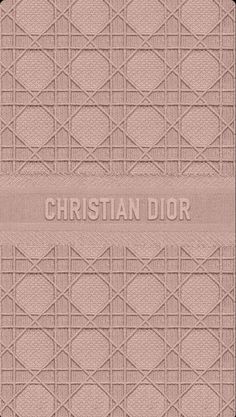 the christian dior logo is shown on a beige background with squares and lines in it