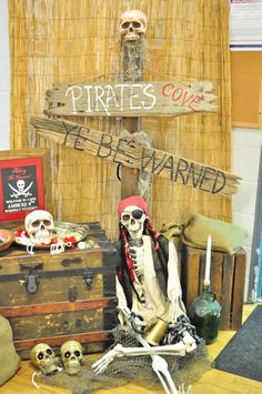 there is a pirate's chest and other items on the table