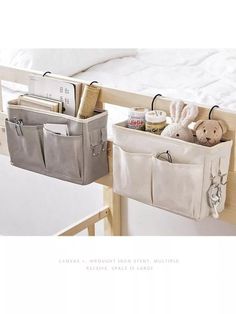 two storage bins with stuffed animals in them hanging from the side of a bunk bed