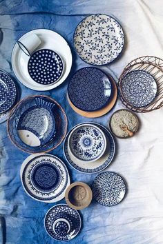 many plates and bowls are arranged on a table