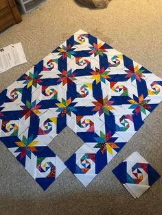 the quilts are laid out on the floor and ready to be sewn