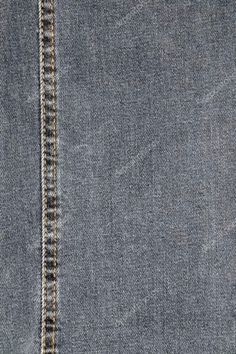 the back side of a pair of jeans with stitching on it and an open pocket