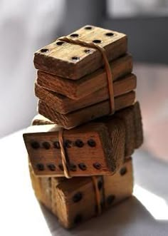 four wooden dominos stacked on top of each other