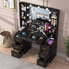 a vanity table with drawers and lights on it