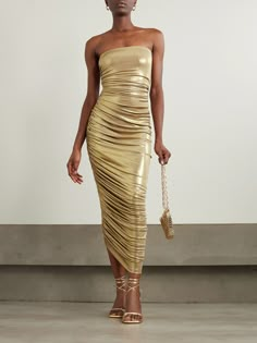 Go for gold at your next event with Norma Kamali's 'Diana' gown. It's made from metallic stretch-jersey that's ruched to accentuate your figure and falls to an asymmetric hem. Complement the strapless neckline with layered chains. Diana Gown, Tropical Outfits, Lame Dress, Gold Trend, Gown Gold, Gold Outfit, Holiday Glam, Strapless Neckline, Layered Chains