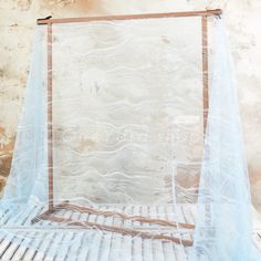 a bed with a blue net over it