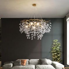 a living room filled with furniture and a large chandelier hanging from the ceiling