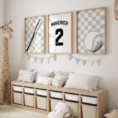 a baseball themed nursery room with posters on the wall and stuffed giraffe in the corner