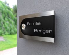 a sign on the side of a building that says family berger