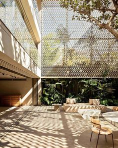 an outdoor living area with tables and chairs