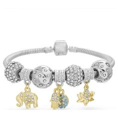 The Lesa Michele Women's White Crystal Charm Beaded Snake Chain Bracelet is a stylish and versatile piece of jewelry designed to cater to the modern woman's fashion preferences. This bracelet features a collection of charming symbols, including the Evil Eye, Elephant, Hamsa, and Lotus Flower. Each charm carries its own unique significance and symbolism, making this bracelet not only fashionable but also meaningful. The bracelet is crafted with a snake chain adorned with white crystal beads. This combination of beads and the snake chain adds texture and visual interest to the piece, creating a dynamic and eye-catching accessory. The bracelet incorporates both yellow gold-tone and silver-tone elements, providing versatility and allowing it to complement a wide range of outfits and jewelry pi Beaded Snake, Beaded Heart, Snake Chain Bracelets, Elephant Charm, The Evil Eye, Crystal Charm, Woman's Fashion, White Crystal, The Snake