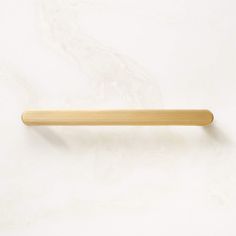 a wooden handle on a white wall