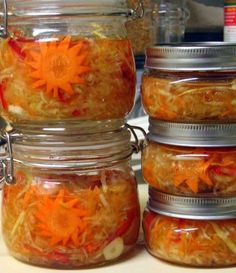 several jars filled with food sitting on top of a counter