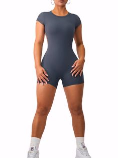 Description: NOW PADDED! This elegant romper is a must-have gym outfit! Its flattering design features an open back that will turn heads while keeping you secure and comfortable. All of our rompers & jumpsuits are made out of high quality blends of nylon and are guaranteed to shape your figure while providing high comfort and sweat resistance. Sizing: We recommend sizing up if you are 5'4 or taller. Color: Charcoal Fabric: Premier Buttersoft Seamless Gym Jumpsuit, Elegant Rompers, Short Romper, Gym Fits, Romper Outfit, Soft Girl, Short Rompers, Gym Outfit, Open Back