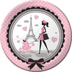 a pink and black plate with a woman walking her poodles in front of the eiffel tower