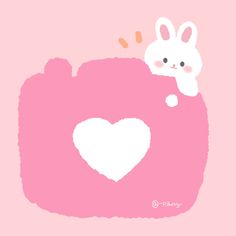 a pink camera with a white rabbit on it's back and a heart in the middle