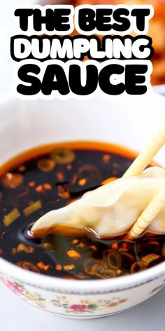 the best dumpling sauce is in a bowl with chopsticks sticking out of it