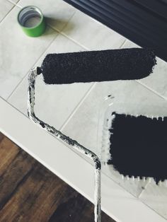 a paint roller with some black paint on it