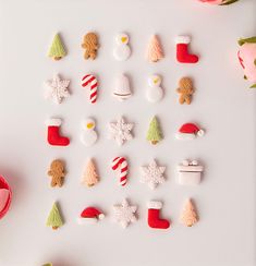 christmas cookies are arranged on a white surface