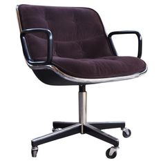 an office chair with wheels and a purple upholstered seat