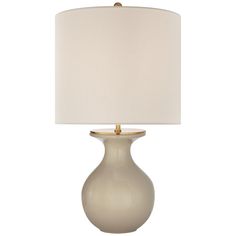 a table lamp with a white shade on it