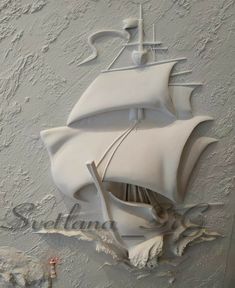 a white wall with a ship painted on it