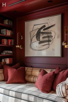 a living room filled with furniture and bookshelves next to a painting on the wall