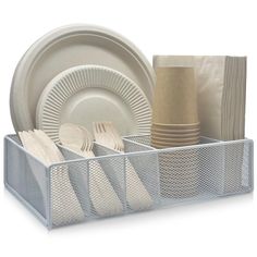 an organized dish rack with plates and napkins