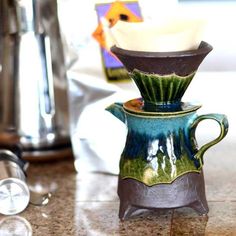 a coffee pot sitting on top of a counter