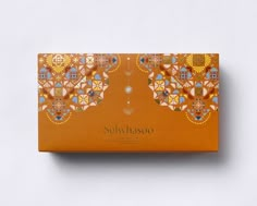 an orange box with designs on it