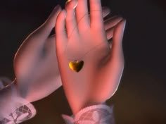 a close up of a person's hand with a heart on it