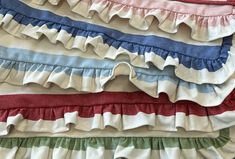 a pile of different colored ruffles on top of each other