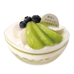 a bowl filled with cucumber and blueberries on top of icecream