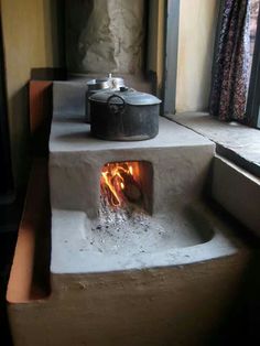 an old stove that has some kind of fire in it