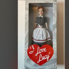 a doll in a box with the words i love lucy on it's back