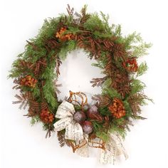 a christmas wreath with pine cones and berries