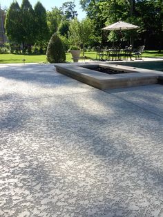 an outdoor patio with tables and umbrellas