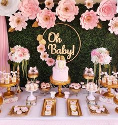 a baby shower party with pink and gold desserts, cake and cupcakes