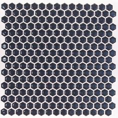 black hexagonal tile with white dots on the top and bottom, against a white background