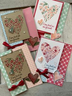 several cards with hearts and flowers on them