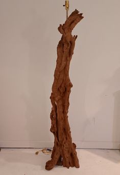 a piece of wood that has been carved to look like a tree