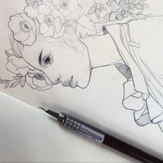 a drawing of a woman with flowers on her head