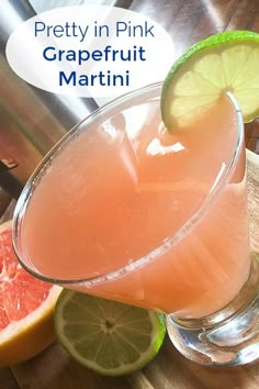 a pink grapefruit martini is garnished with lime