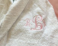 * Embroidered Cotton Robe, Long Length Cotton Bathrobe Customized * Hands down the best Stay at home Gift. A Hooded plush Robe is a Necessary Gift. They've worked so hard and when its time to unwind and relax, they can be cozy and stylish. * This Extra Soft Turkish Terry Cotton Bathrobe is warmth and comfort and also highly absorbent. * Something they can unwind and relax in, take to the beach, the pool, the spa and to the shower.  * Experience a true Luxury Retreat  style robe, a plush soft Terry robe whose quality stands out. * Personalized in their favorite color with a name, initial/s or Monogram. ( picture shows a pink Wrexam Script Name on a white) * To have a heart or crown embroidered at the back of the robe, choose front and back Embroidery and specify your color in notes to selle Robe Embroidery Ideas, Monogram Robe, Personalized Bathrobe, Dorm Room Gifts, Embroidered Robe, Monogram Robes, Cotton Bathrobe, Plush Robe, Terry Robe