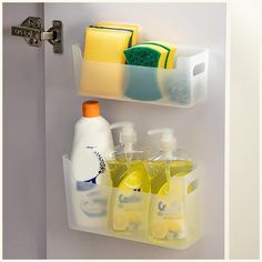 two plastic containers with soap, detergent and sponges hanging on the wall